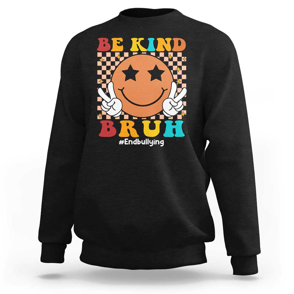 Black crewneck sweatshirt with smiley anti-bullying graphic and "Be Kind" front print