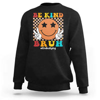 Black crewneck sweatshirt with smiley anti-bullying graphic and "Be Kind" front print