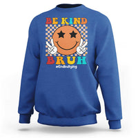 Royal blue crewneck sweatshirt with smiley anti-bullying graphic and "Be Kind" print