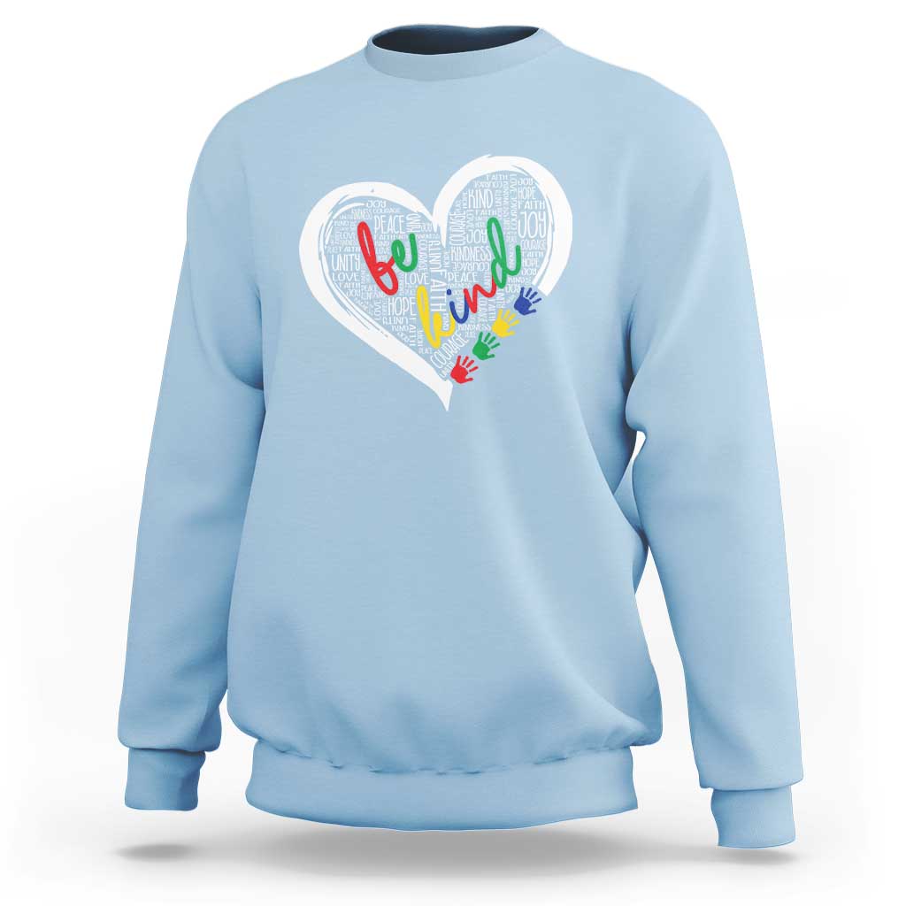Light blue sweatshirt with large white heart graphic and colorful message text art