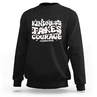 Black crewneck sweatshirt with “Kindness Takes Courage” anti-bullying graphic