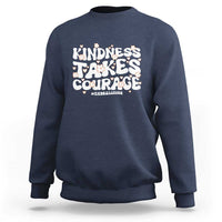 Navy crewneck sweatshirt with “Kindness Takes Courage” anti-bullying graphic