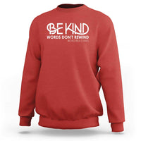 Red sweatshirt with 'Be Kind' and 'Words Don't Rewind' anti-bullying text