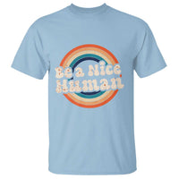 Light blue T-shirt with 'Be a nice human' rainbow circle graphic at center.