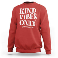 Red sweatshirt with “KIND VIBES ONLY” slogan graphic and #END BULLYING text