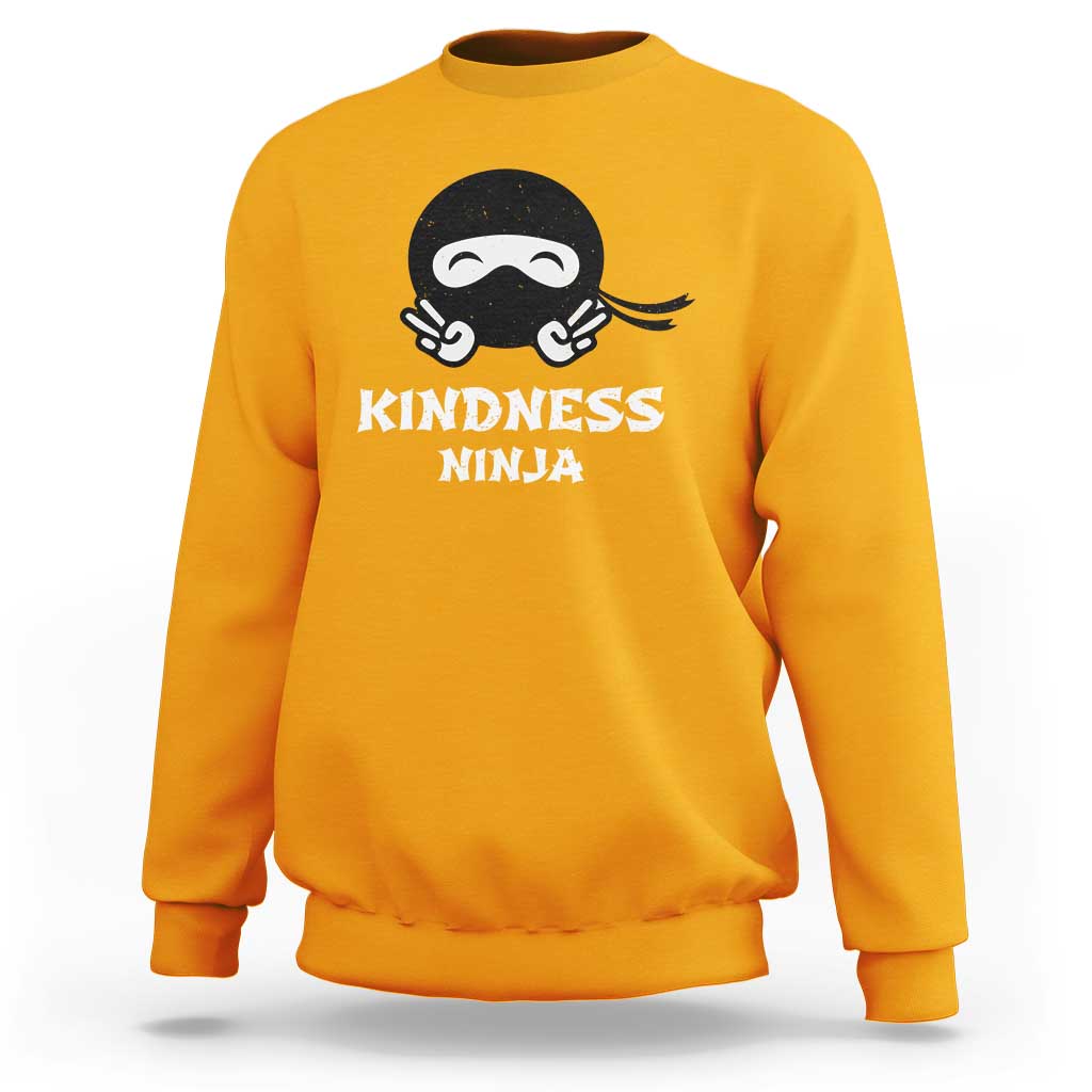 Gold sweatshirt with Kindness Ninja front graphic