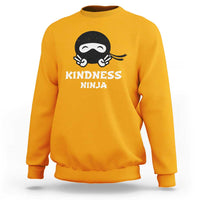 Gold sweatshirt with Kindness Ninja front graphic