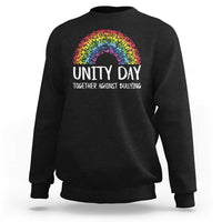 Black crewneck sweatshirt with rainbow arch graphic and “UNITY DAY” front text