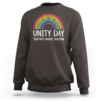 Charcoal crewneck sweatshirt with rainbow arch graphic and “UNITY DAY” front text