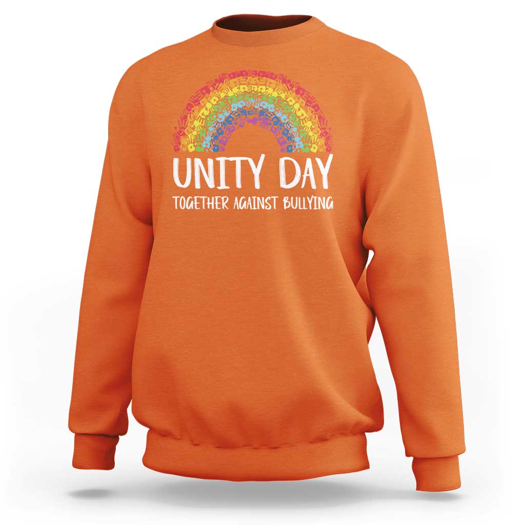 Orange crewneck sweatshirt with rainbow arch graphic and “UNITY DAY” front text