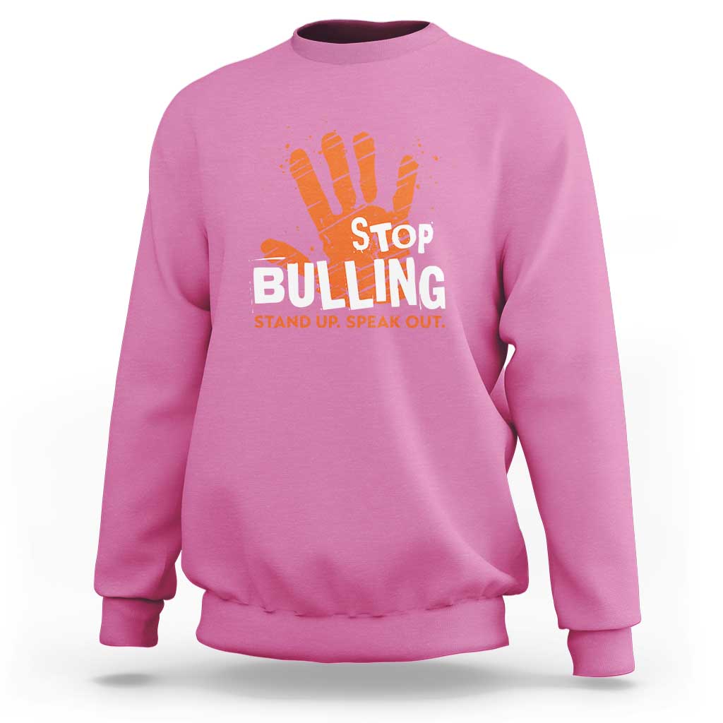 Pink sweatshirt with front STOP BULLYING graphic and orange hand illustration
