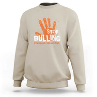 Beige sweatshirt with front STOP BULLYING graphic and orange hand illustration