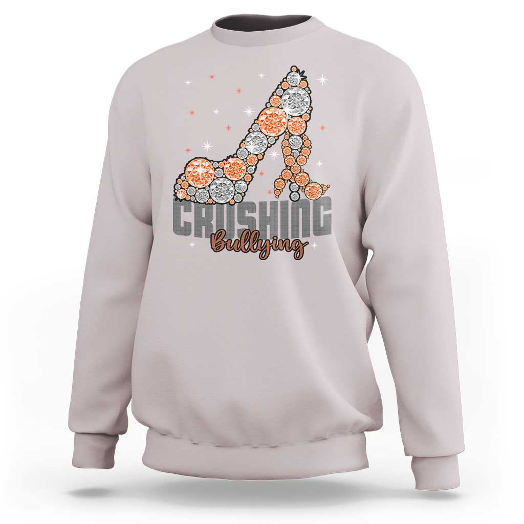 Light gray sweatshirt with “Crushing Bullying” graphic and orange dotted ribbon