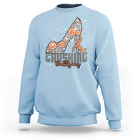 Light blue sweatshirt with “Crushing Bullying” graphic and orange dotted ribbon