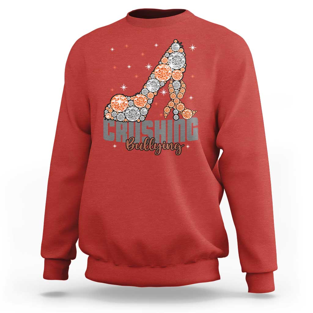 Red sweatshirt with “Crushing Bullying” graphic and orange dotted ribbon