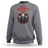 Charcoal gray horror Christmas sweatshirt with 'Merry Krampus' graphic on chest.