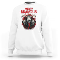 White horror Christmas sweatshirt with 'Merry Krampus' graphic on chest.