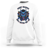 White crewneck sweatshirt with colorful Krampus face graphic on front.