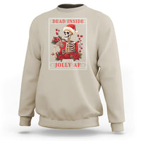 Sand Christmas sweatshirt with skeleton holding roses and “DEAD INSIDE BUT JOLLY AF” print