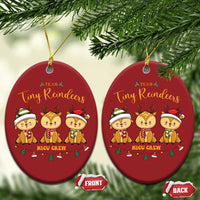 Two red oval Christmas ornaments with Tiny Reindeers and NICU Crew, gold hanging loops