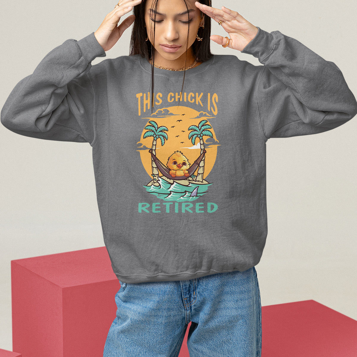 Women's charcoal sweatshirt with “THIS CHICK IS RETIRED” palm graphic, relaxed pullover