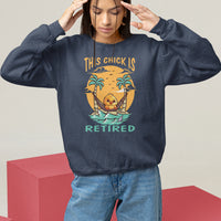 Women's navy sweatshirt with “THIS CHICK IS RETIRED” palm graphic, crewneck, long sleeves