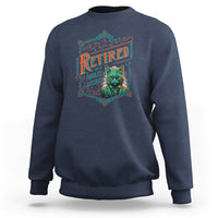 Navy retirement sweatshirt with colorful "Retired" cat graphic on chest