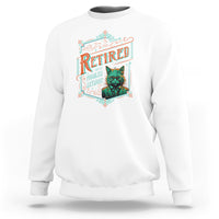 White retirement sweatshirt with colorful "Retired" cat graphic on chest