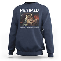 Navy crewneck sweatshirt with 'Retired' cat newspaper graphic, 'Not My Problem Anymore'.