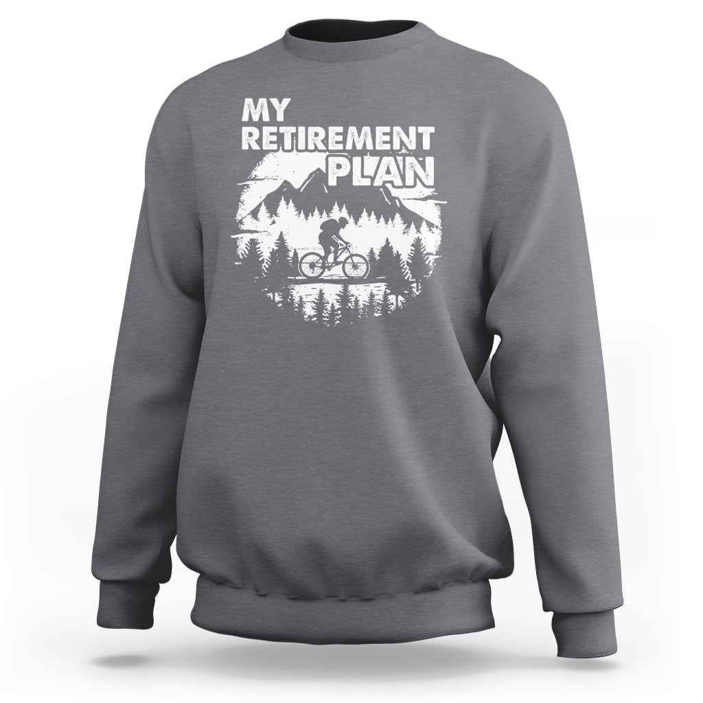 Charcoal crewneck sweatshirt with 'MY RETIREMENT PLAN' bicycle graphic, back view
