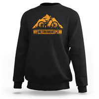 Black crewneck sweatshirt with orange bicycle retirement plan graphic
