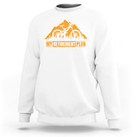 White crewneck sweatshirt with orange bicycle retirement plan graphic