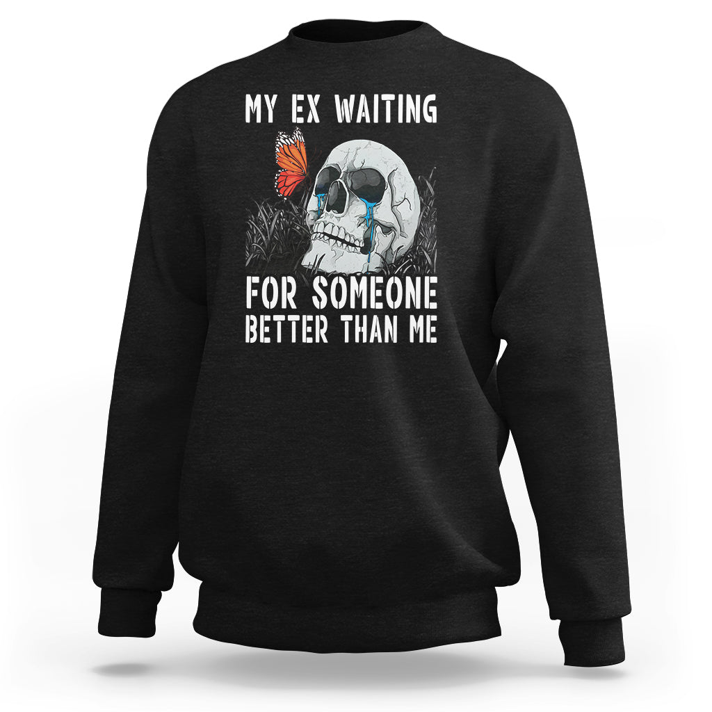 Black crewneck sweatshirt with skeleton and butterfly graphic plus white slogan text