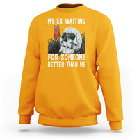 Gold crewneck sweatshirt with skeleton and butterfly graphic plus white slogan text