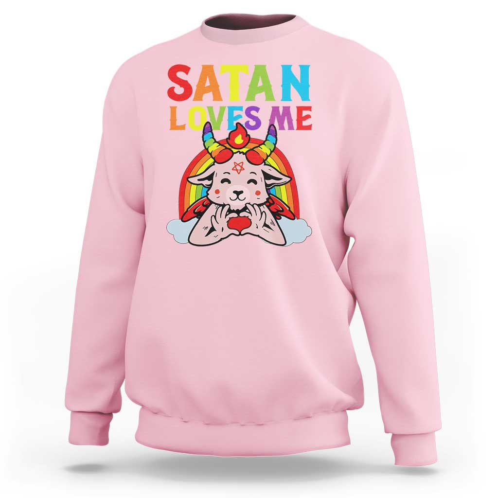 Light pink sweatshirt with “SATAN LOVES ME” rainbow goat graphic, long sleeves