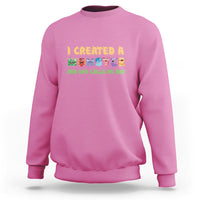 Azalea pink sweatshirt with “I created a monster” dad graphic on front