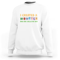 White sweatshirt with “I created a monster” dad graphic on front