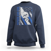 Navy crewneck sweatshirt with blue chest graphic of two fists and star pattern.