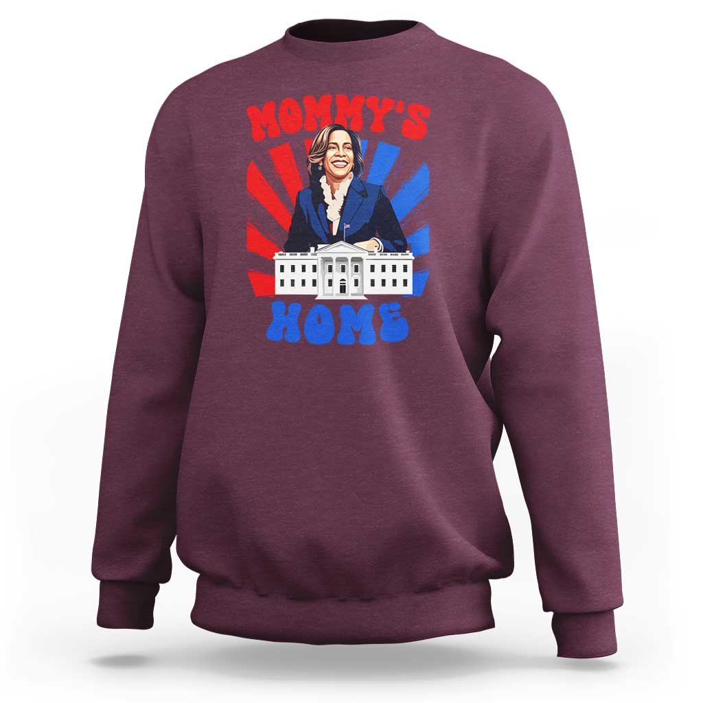 Maroon crewneck sweatshirt with “MOMMY’S HOME” graphic featuring a woman and building.