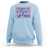 Light blue crewneck sweatshirt with red and blue “My #BlackJob is Voting” graphic