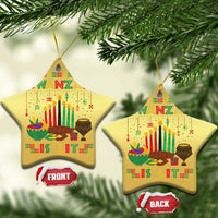 Two gold star-shaped Kwanzaa ornaments with “Kwanzaa” and candle symbols, front/back tags