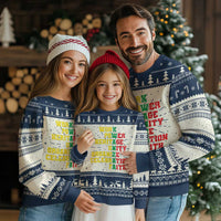 Navy Christmas sweater with white fair isle trees and multicolor “heritage unity” slogan