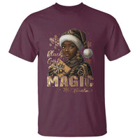 Maroon Christmas graphic T-shirt with woman portrait, “MAGIC” text, and snowflakes