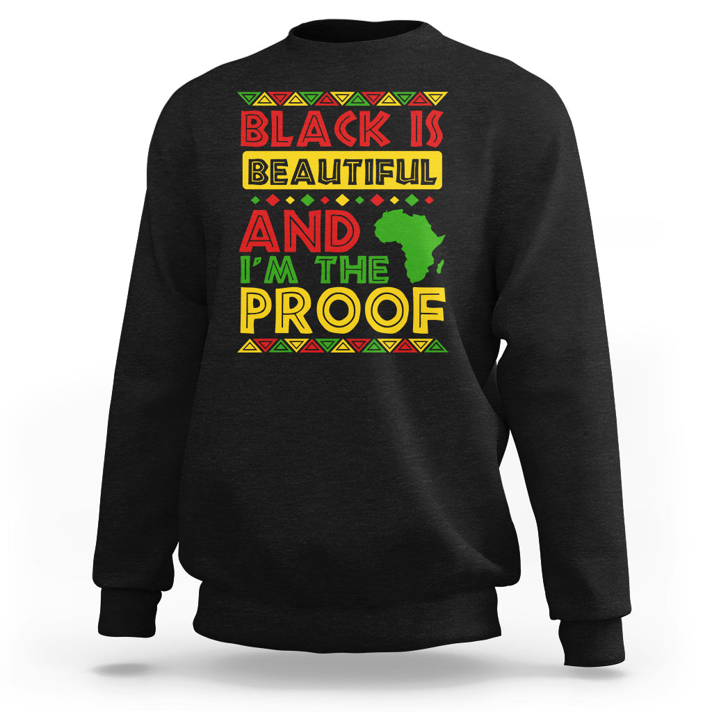 Black crewneck sweatshirt with colorful 'Black Is Beautiful' graphic on chest