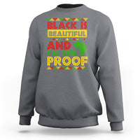 Charcoal crewneck sweatshirt with colorful 'Black Is Beautiful' graphic on chest