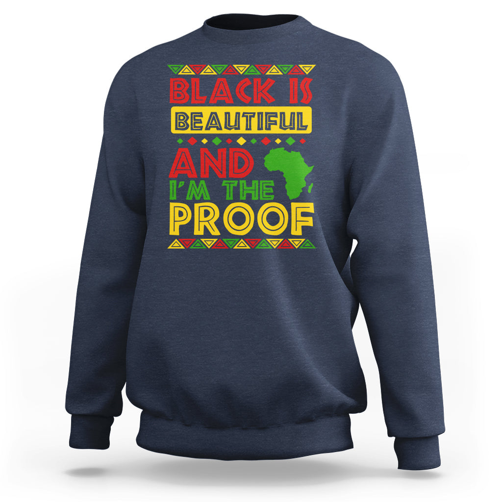 Navy crewneck sweatshirt with colorful 'Black Is Beautiful' graphic on chest