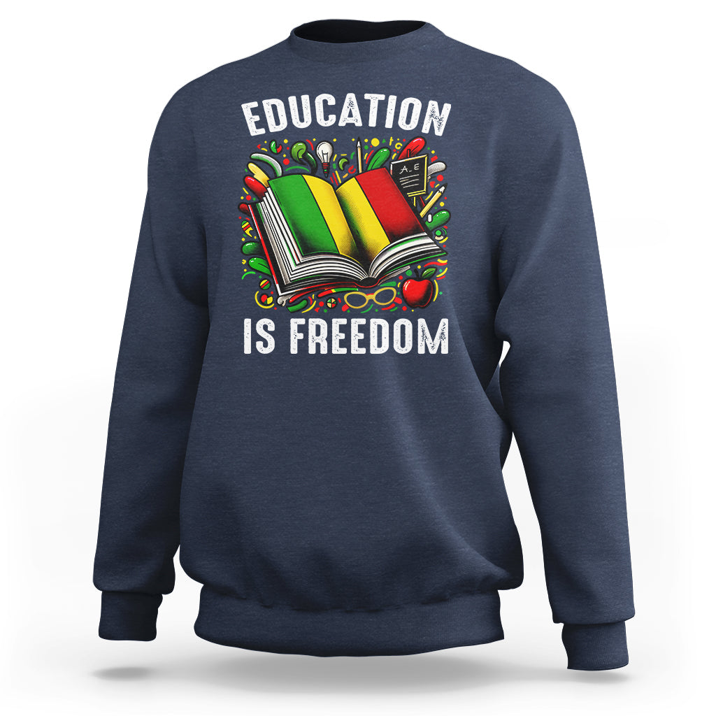 Navy sweatshirt with “EDUCATION IS FREEDOM” book graphic