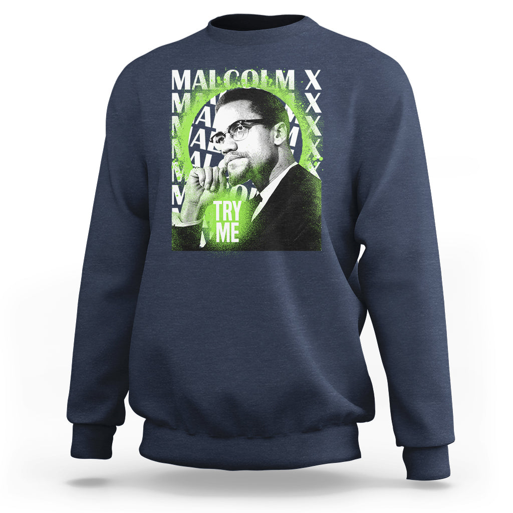 Navy crewneck sweatshirt with Malcolm X portrait graphic and “Try Me” text