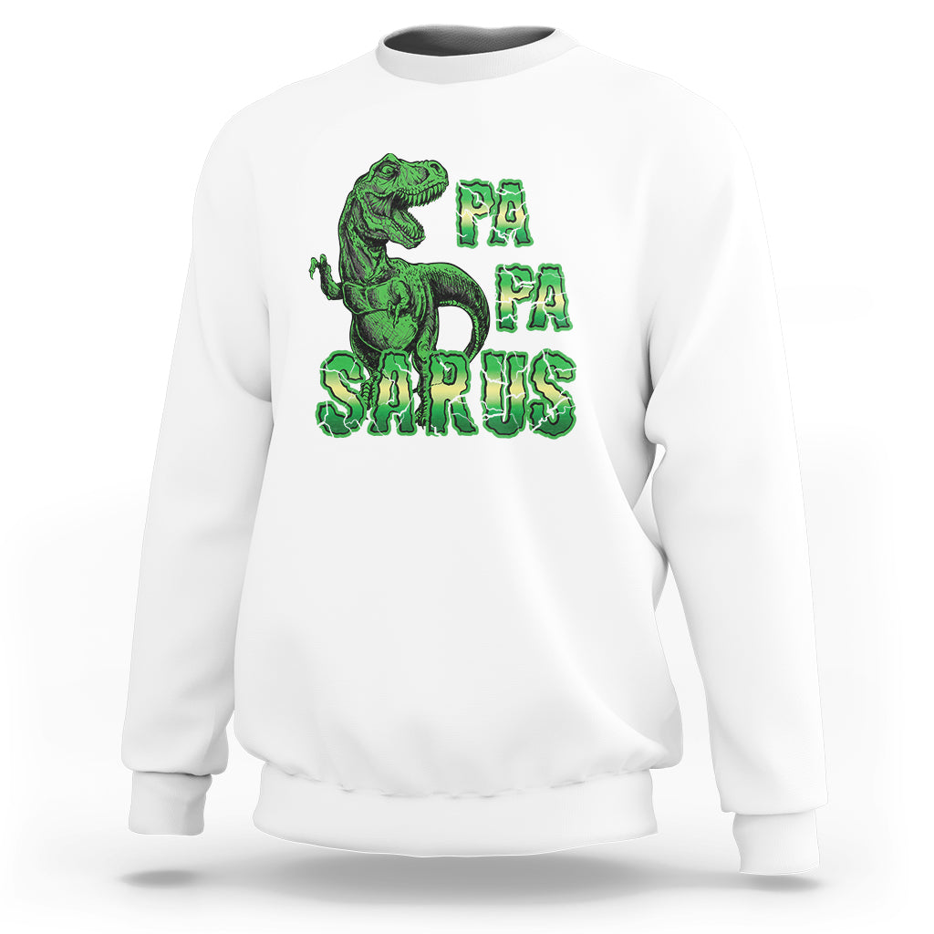 White sweatshirt with green dinosaur and "PA PA SAURUS" graphic