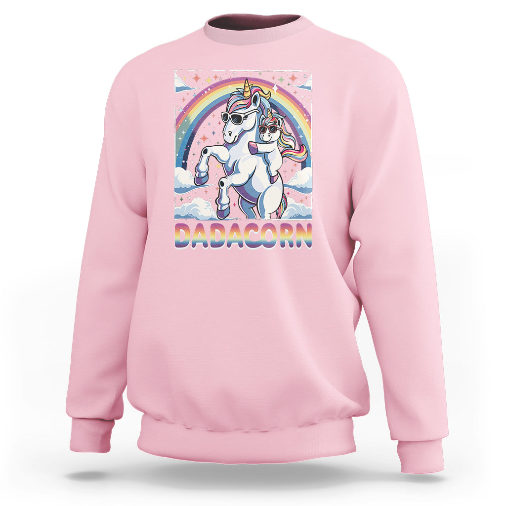 Pink sweatshirt with unicorn graphic and rainbow arch on the front